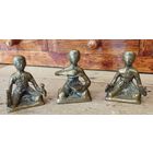 Три бронзовых человека