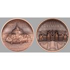 Острова Кука 2х1 доллару 2023-24гг. "Остров Мон-Сен-Мишель; Замок Шамбор". Монеты в капсулах; сертификаты. МЕДЬ 2х50гр.