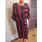 Стильное платье на 64-68 размер, идеальное состояние. Очень хорошо смотрится на фигуре, современно и красиво. Платье прямого фасона, талия регулируется поясом, сзади замок, на подкладке.