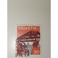 Марка Швейцария 1973 год 30 сантимов из серии "Здания" (традиционный дом в долине Симменталь).