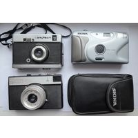 Три разных Фотоаппарата.Взводятся.Щелкают.