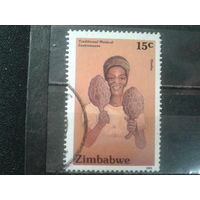 Зимбабве, 1991. Женщина с муз. инструментом хошо
