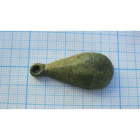 Половинка древней привески. Бронза, литье.