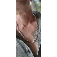 Шикарная,серебряная.Мужская цепь.Вес 74 грамма, ширина звена 9мм.Длинна 60см.