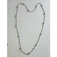 Цепочка похожа на серебро но пробы нет  , не магнит . С рубля .