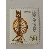 Марка из седьмого стандартного выпуска 2007 года - Прялка