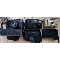 Три пленочных фотоаппарата.