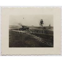 Подбитый и горящий советский легкий огнеметный танк ХТ-133.