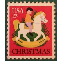 1978 Рождественская марка(Ребенок на лошадке-качалке)США