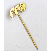 Корпоративный или тематический значок из прошлого. Логотип состоит из стилизованных букв "FF" и знака, напоминающего шестеренку или цветок внутри круга