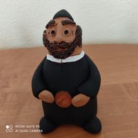 Еврей с монетой статуэтка
