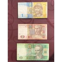 Три банкноты Украины: 1 гривна 2006 года, 2 гривны 2005 года и 20 гривен 2005 года